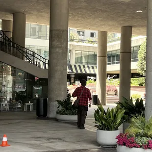 From Van Ness, go up the steps to the far right corner of the plaza to find Leonore's!