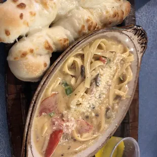 Delicious Alfredo supreme and cheesy breadsticks!