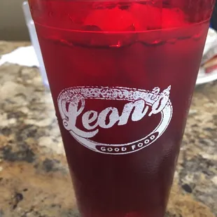 a red glass with a straw