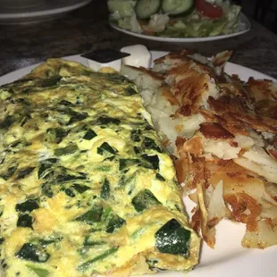 an omelet and potatoes