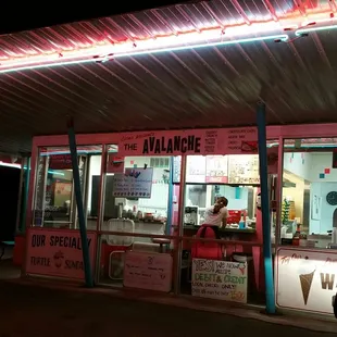 The drive-up store front. Turn your headlights on and a server in 50's style clothes will come to your car to take your order.