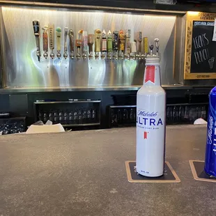 two bottles of ultra on a bar