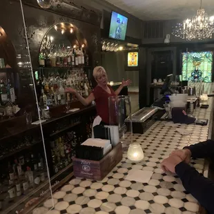 a woman behind the bar