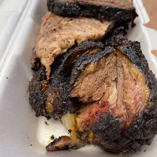 a closeup of the meat in a styrofoam container