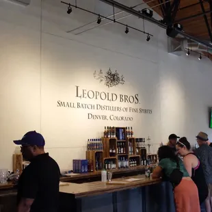 people standing in line at the bar