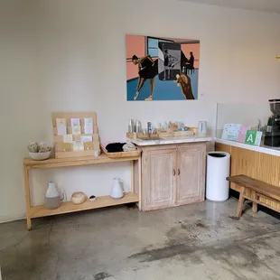 a kitchen with a sink, counter, and cabinets