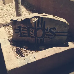 Stone sign outside Leo's.