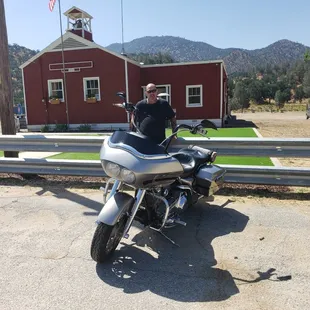 a man sitting on a motorcycle