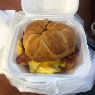 a breakfast sandwich in a styrofoam container