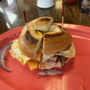 Ham egg &amp; cheese with raw onions  &amp; light mayo on a plain bagel. This dish had me full &amp; ready to go to sleep .