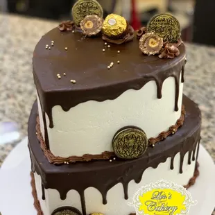 Heart shaped cake, topped with melted chocolate fudge and Oreo cookies.