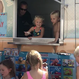 Birthday girl serving ice cream to her guests!
