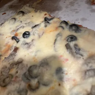 a half eaten pizza in a box