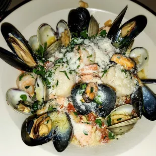 Seafood (shrimp, scallops, clams, mussels, fish) linguine in a lemon sauce