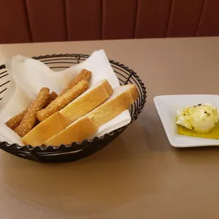 Complementary bread with butter and herb-infused olive oil!