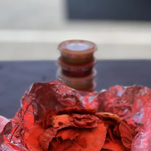 a bowl of chips and a jar of salt
