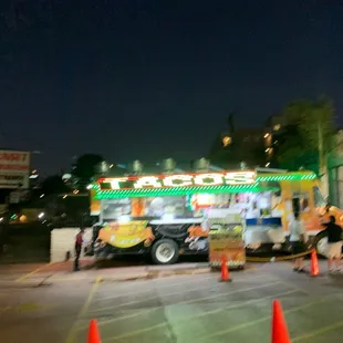 a taco truck in a parking lot