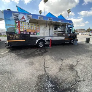 a taco truck parked in a parking lot