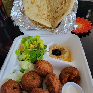 Love these falafels!  Served with salad,  hummus, pita