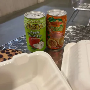 two cans of juice and a can of apple pie