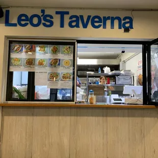 a man sitting in front of a window