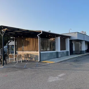 This is the view of the back of the restaurant from the parking lot. The entrance is around the patio on the other side of the building.