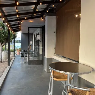 This is the walkway around the corner from the patio. The black open door is the entrance.