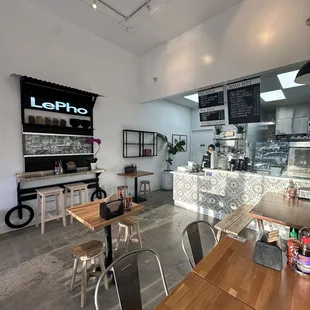 the inside of a restaurant with tables and chairs