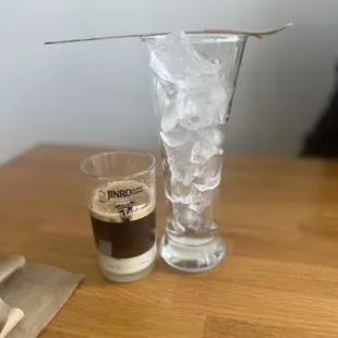 a cup of coffee and a glass of ice