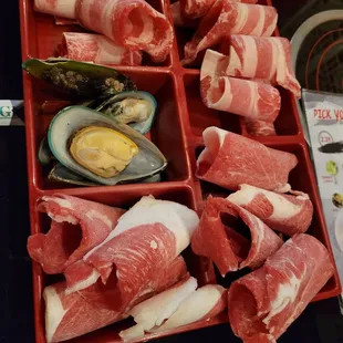 a tray of meat wrapped in bacon