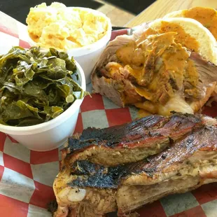 Two meat platter - ribs and brisket with greens and potato salad