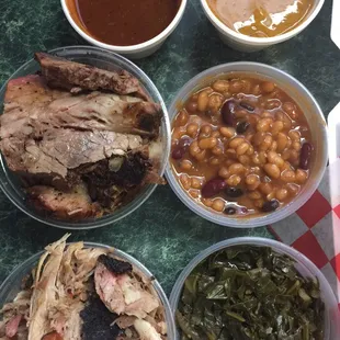 Beginning with the top right... tomato based sauce, mustard based sauce, beef brisket, baked beans, pulled pork, and collard greens.
