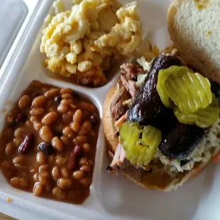 A sausage other meat sandwich with some of the best beans and mac and cheese I've ever had
