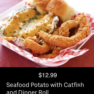 Seafood Baked Potato with Fried Catfish and dinner roll.