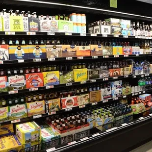 a large selection of beer in a grocery store