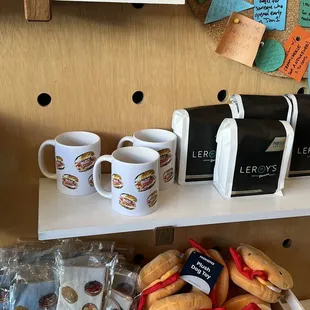 a shelf of coffee and hotdogs