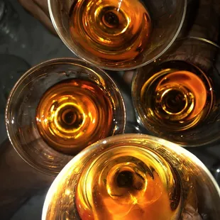 four glasses of wine on a table