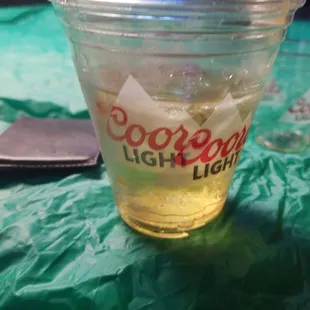 a cold drink in a plastic cup