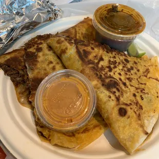 Quesabirria! So yummy! Tasty consome and kicking hot sauce to boot. 5Stars! Enough for two. Must try!