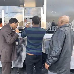 Grabbing a plate at catering even