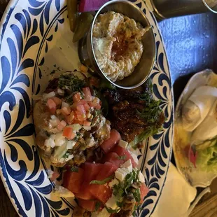 4 appetizers plate  Baba Ghanouje, watermelon salad, Fried Cauliflower, and chicken wings
