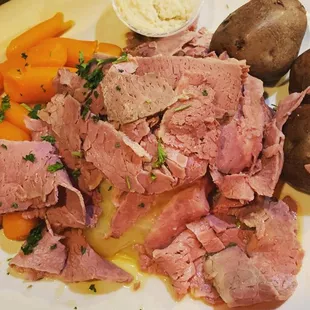a plate of meat and vegetables