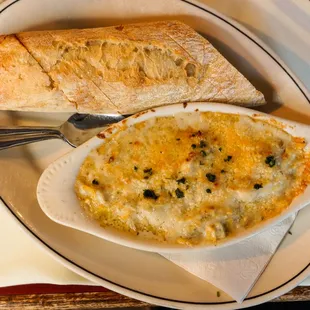 Warm Artichoke Gratin Artichoke hearts, béchamel, mixed cheese (Gruyère, Manchego, mozzarella) + batard toast