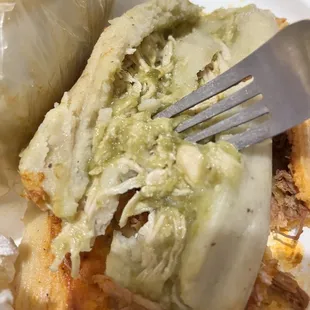Deconstructed pork tamale( I think it&apos;s pork) with a little spice but tolerable. The one underneath was the chicken ( I believe) tamale.