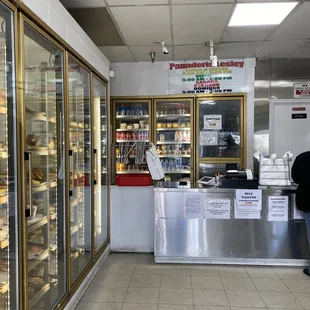 a bakery counter with a variety of pastries