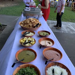 Cilantro, onions, green, red, and chipotle salsas as well as guacamole, chips and cheese (by request).