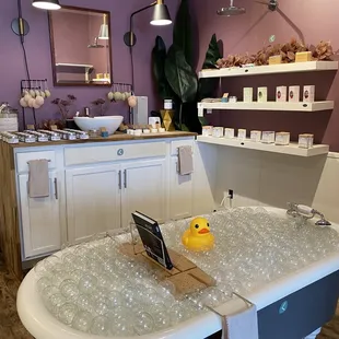 a bathtub with a laptop in it