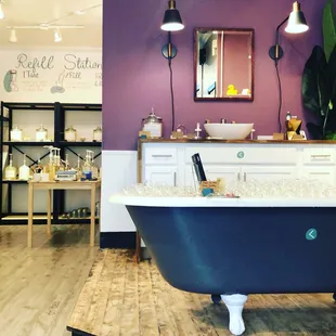 a bathtub in a purple bathroom