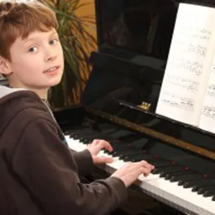 Thomas B. taking piano lessons in Castle Pines