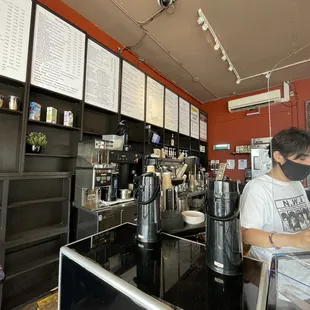 a man working at a coffee shop